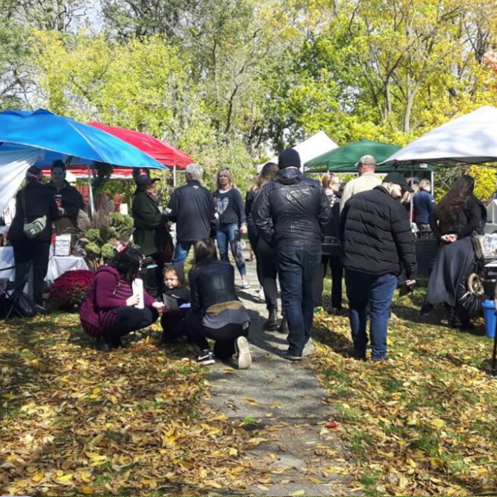 photo of many people at an outdoor fall market